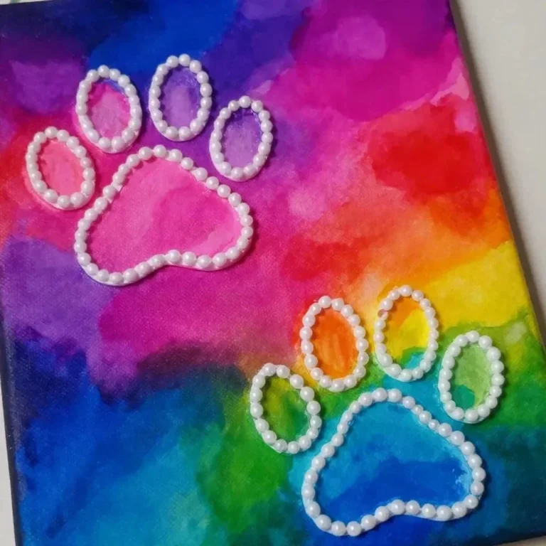 Rainbow Puppy Paw raised-salt painting showcasing colorful artistic textures.